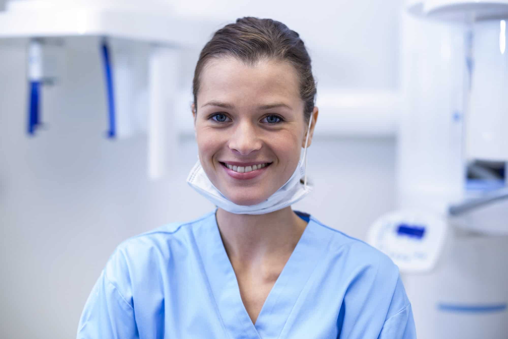 smiling-dental-assistant-in-dental-clinic-1.jpg